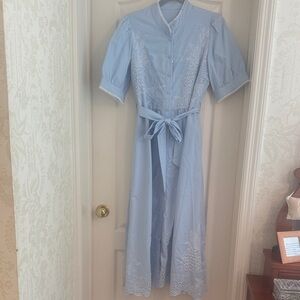 Pale blue long dress with white cut work.
